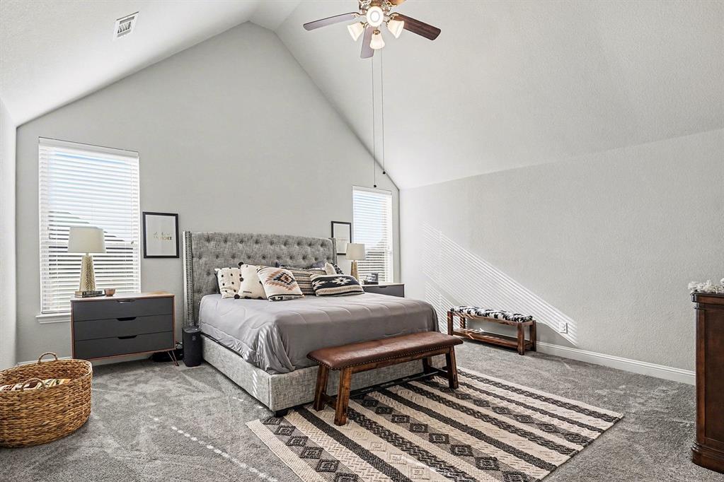 415 Silver Spur Trail Rockwall, TX 75032 - Photo 16 of 40 a bedroom with bed and window