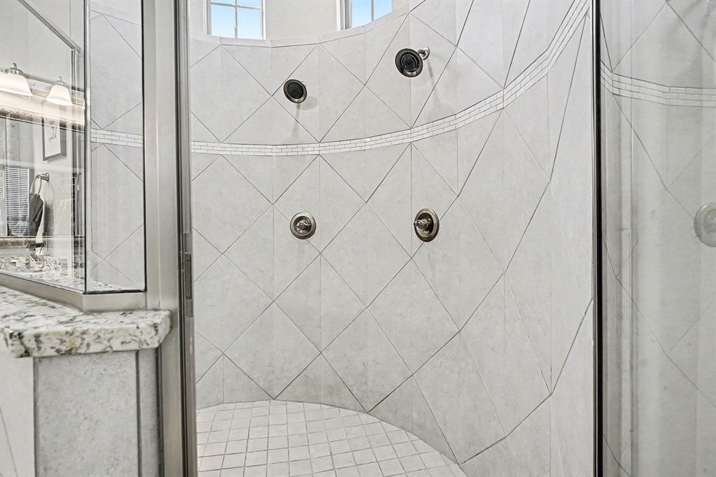 415 Silver Spur Trail Rockwall, TX 75032 - Photo 20 of 40 a bathroom with a shower
