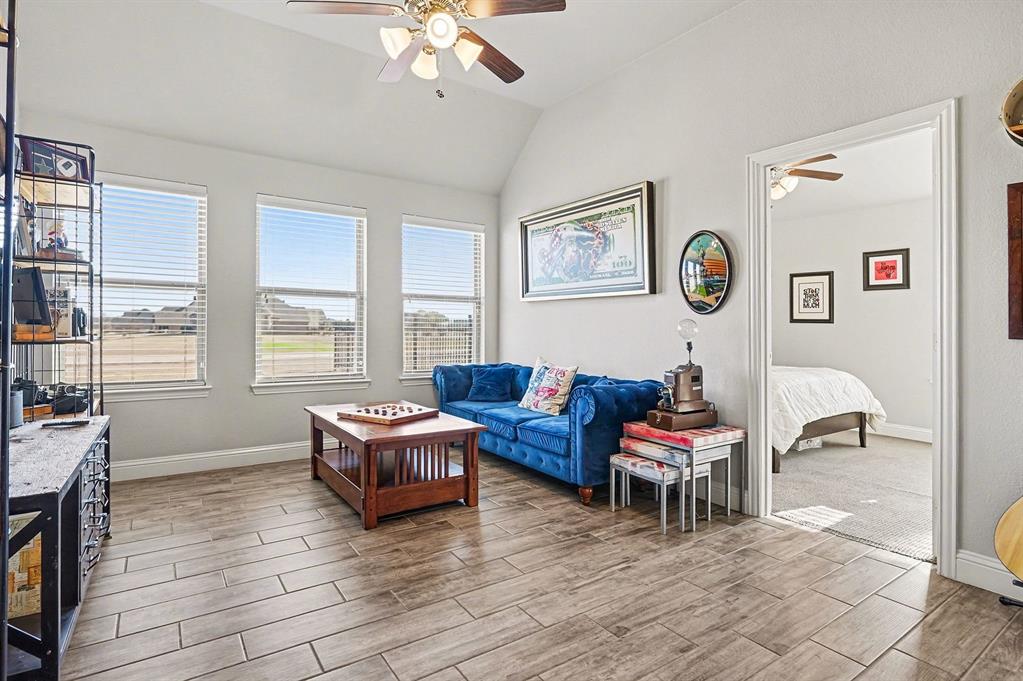415 Silver Spur Trail Rockwall, TX 75032 - Photo 23 of 40 a living room with furniture and a window