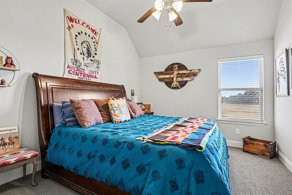 415 Silver Spur Trail Rockwall, TX 75032 - Photo 30 of 40 a bedroom with a bed and a window