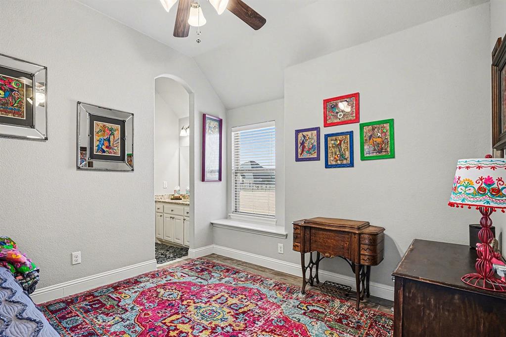 415 Silver Spur Trail Rockwall, TX 75032 - Photo 32 of 40 a bedroom with furniture and a window