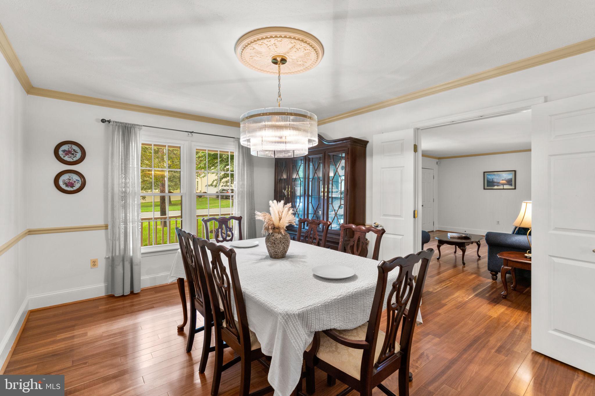 7884 Walnut Grove Road Severn, MD 21144 - Photo 15 of 42 a view of a dining room with furniture window and wooden floor