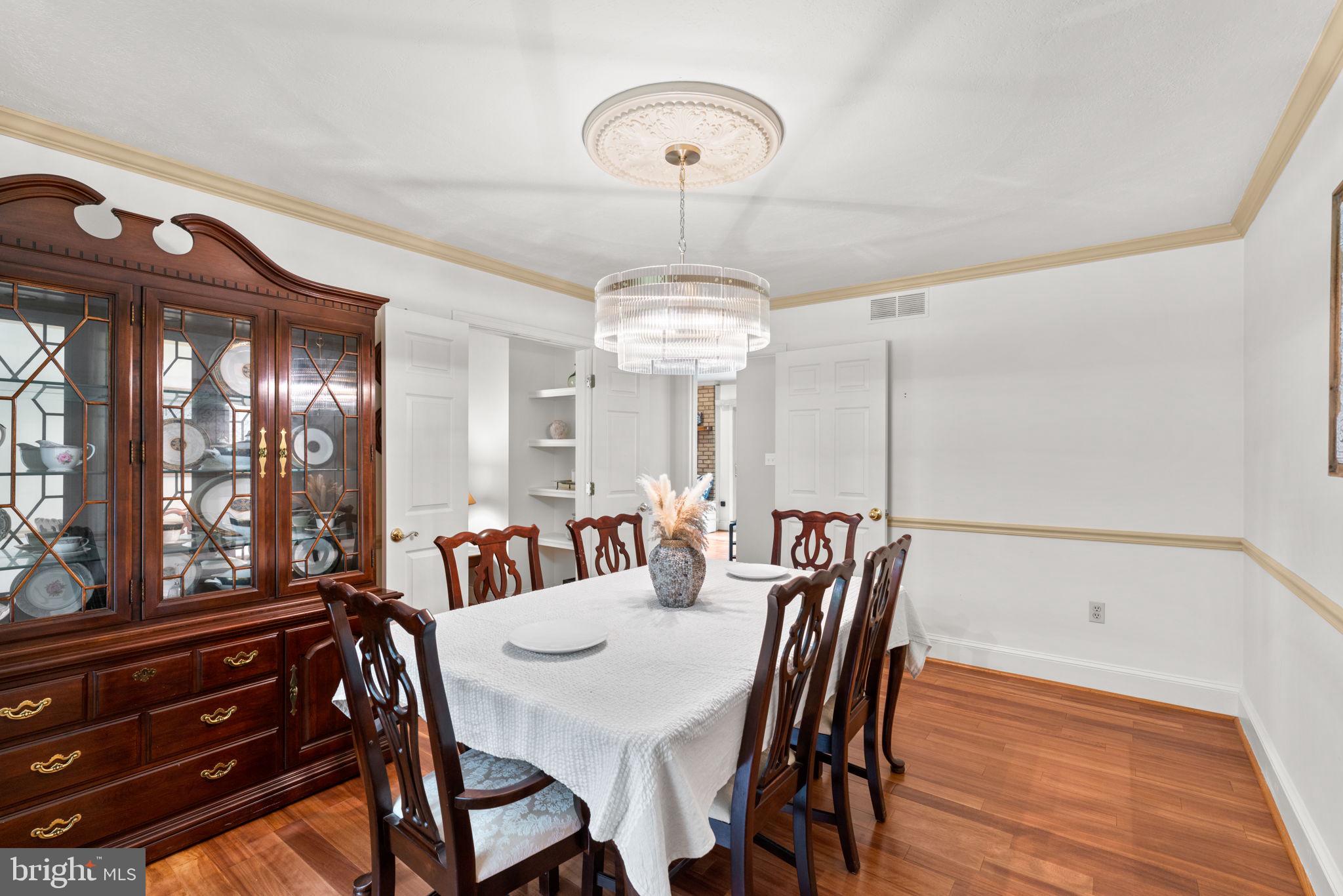 7884 Walnut Grove Road Severn, MD 21144 - Photo 16 of 42 a view of a dining room with furniture window and outside view