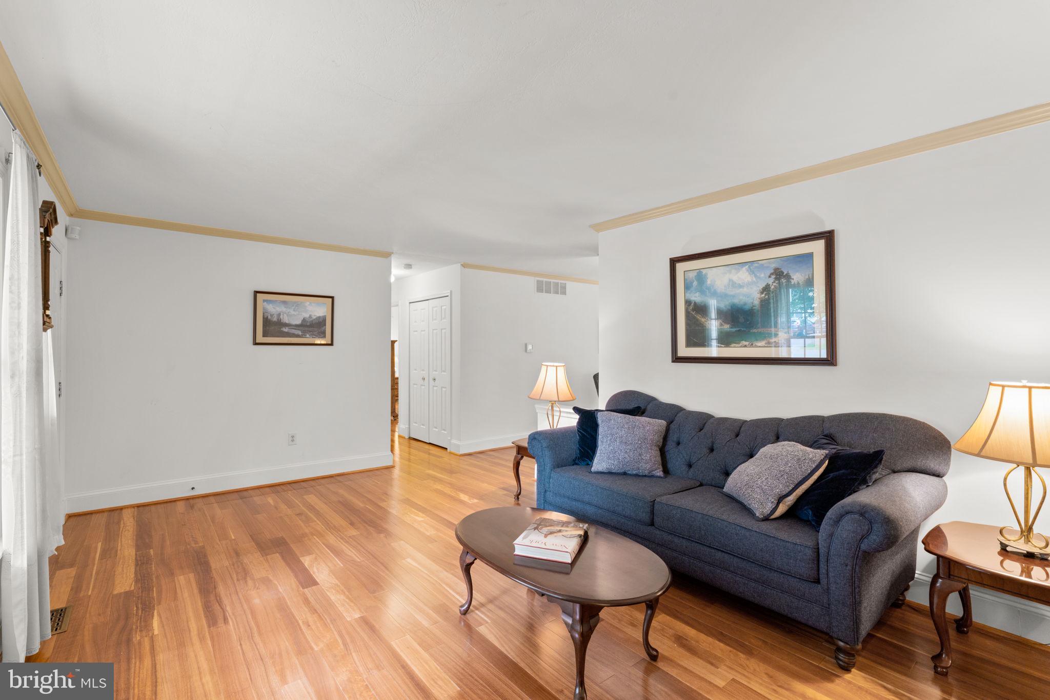 7884 Walnut Grove Road Severn, MD 21144 - Photo 19 of 42 a living room with furniture and a wooden floor
