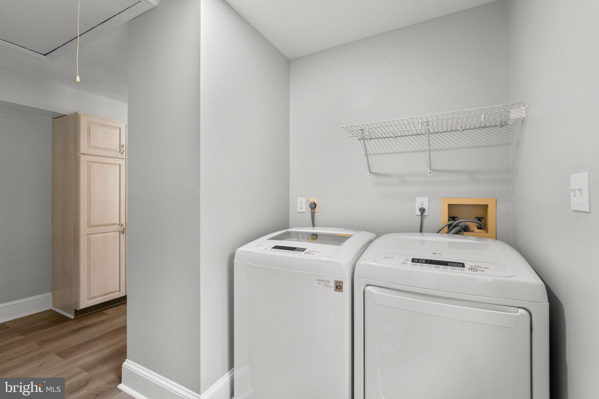 7884 Walnut Grove Road Severn, MD 21144 - Photo 29 of 42 a utility room with dryer and washer
