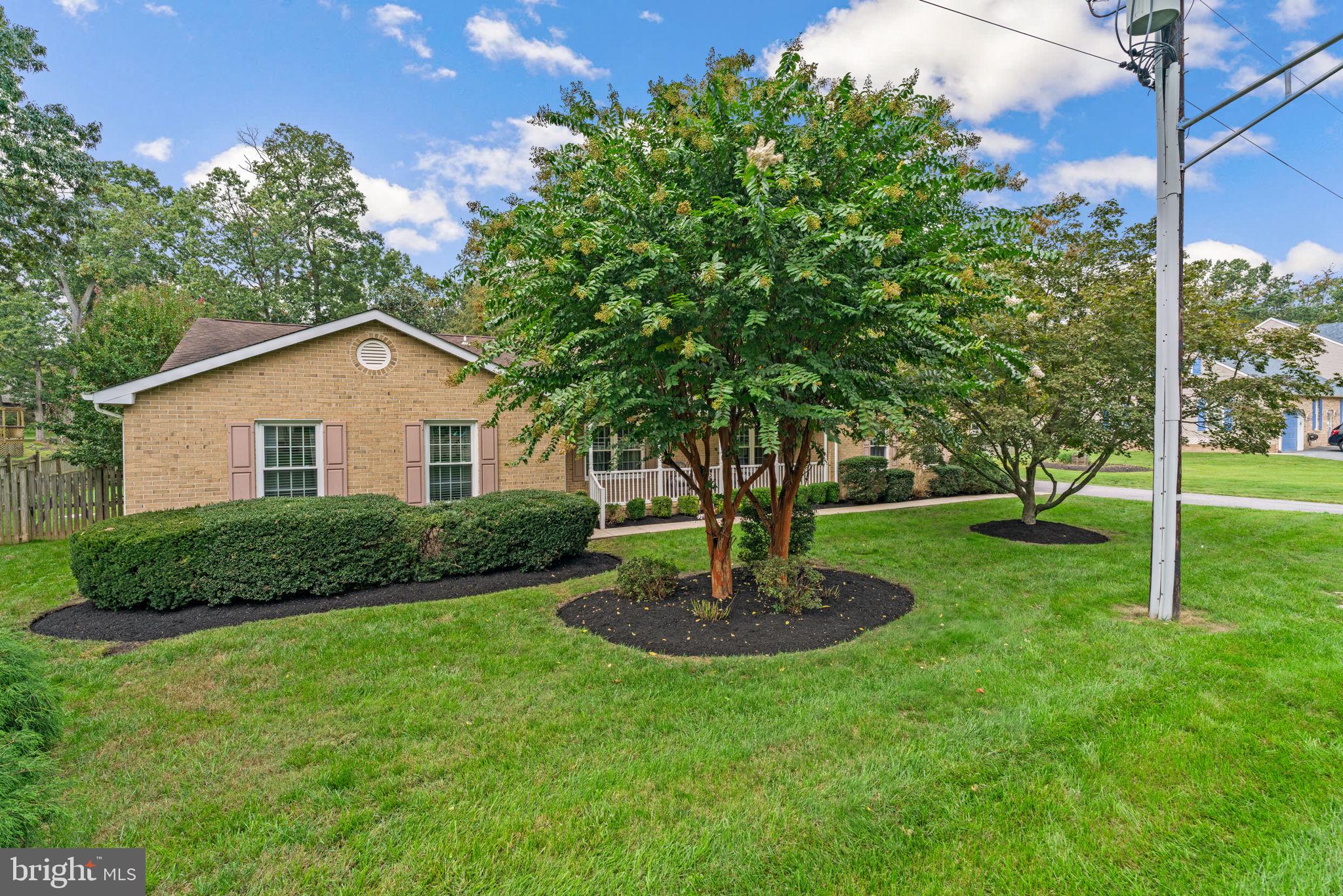 7884 Walnut Grove Road Severn, MD 21144 - Photo 3 of 42 a front view of a house with a yard and green space