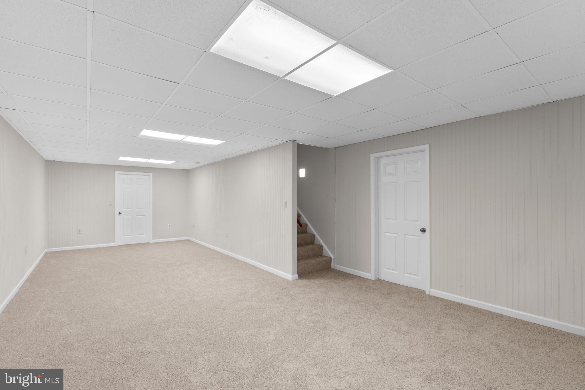 7884 Walnut Grove Road Severn, MD 21144 - Photo 31 of 42 an empty room with a empty space and windows
