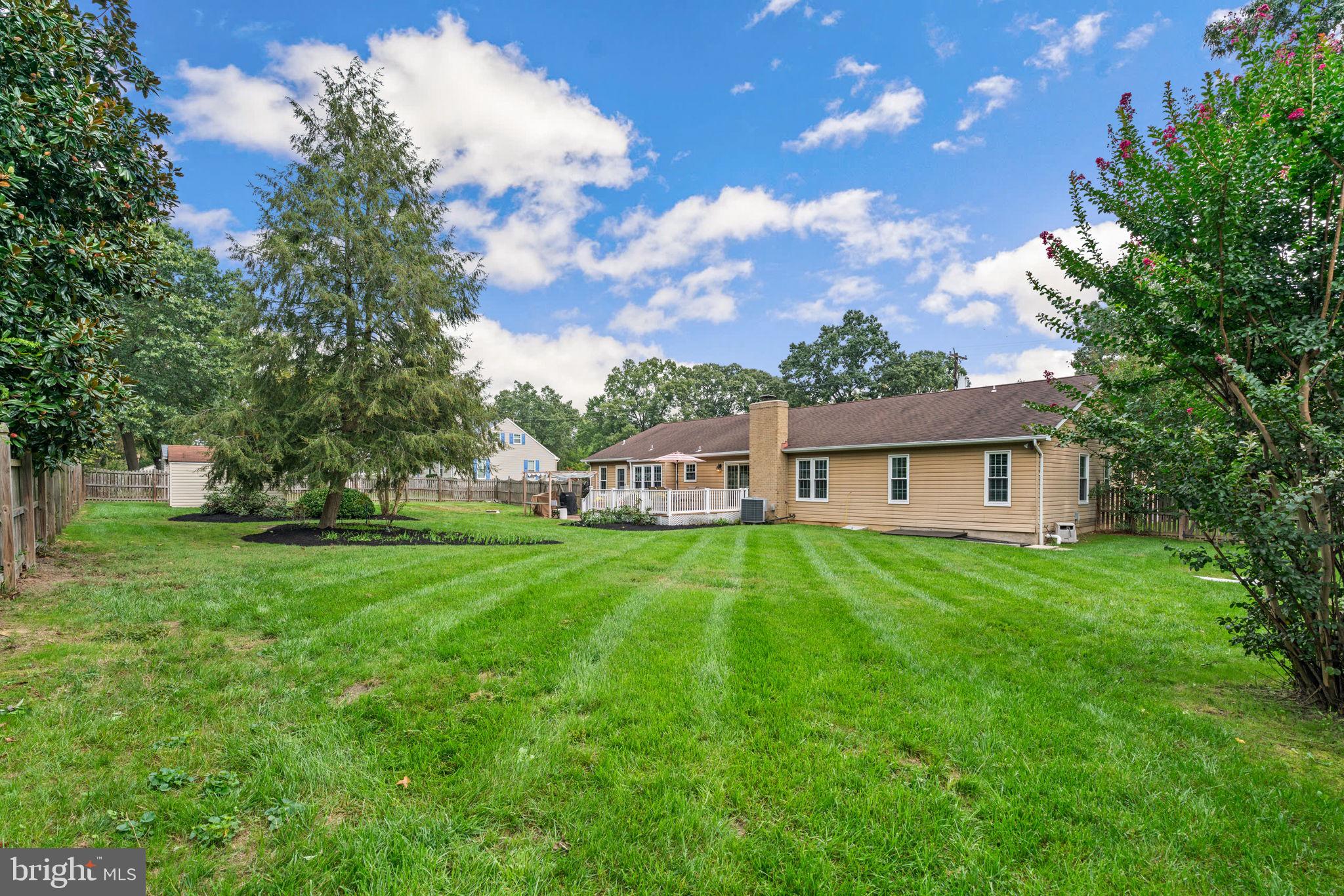7884 Walnut Grove Road Severn, MD 21144 - Photo 35 of 42 a front view of a house with a garden