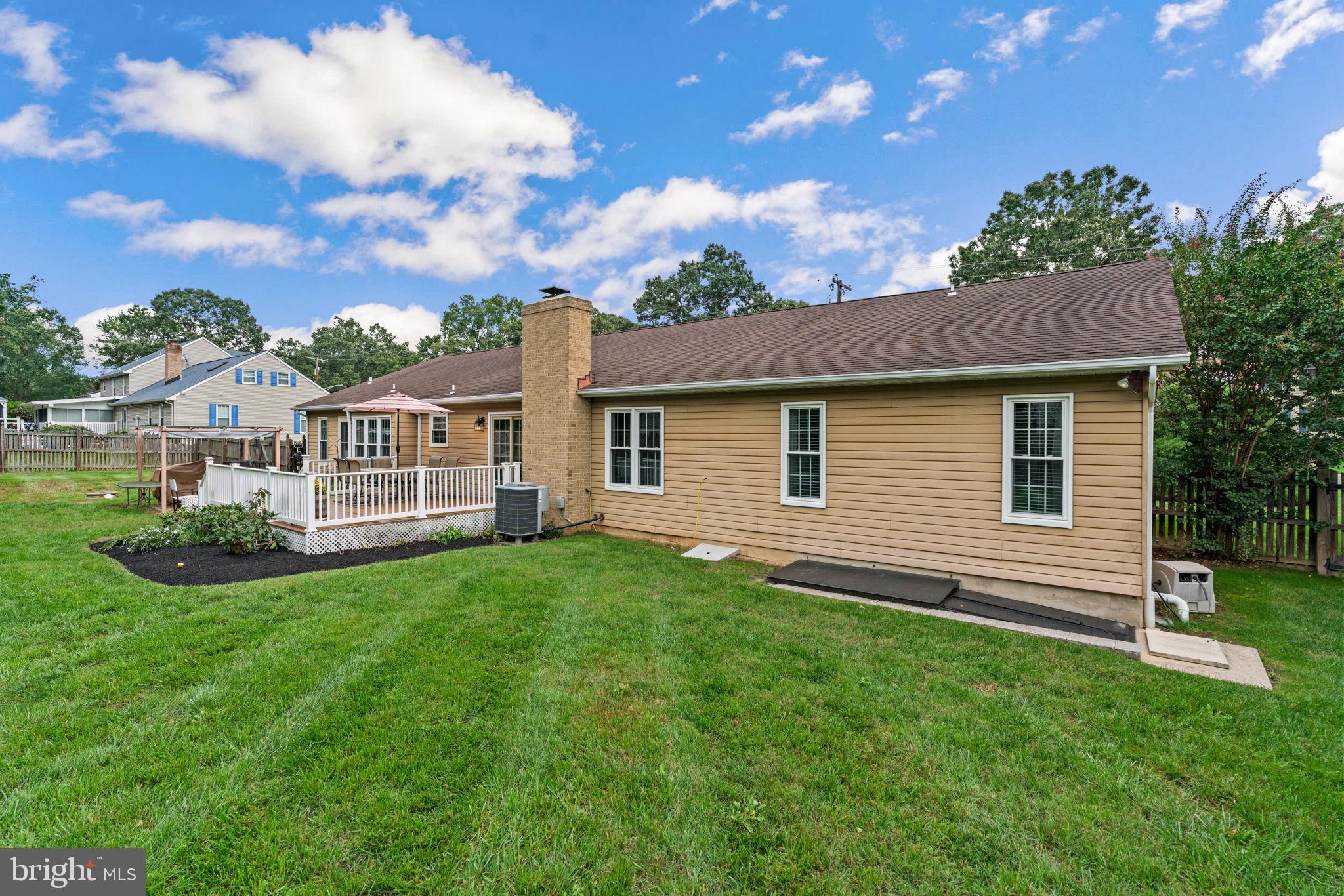 7884 Walnut Grove Road Severn, MD 21144 - Photo 36 of 42 a view of an house with backyard space and garden