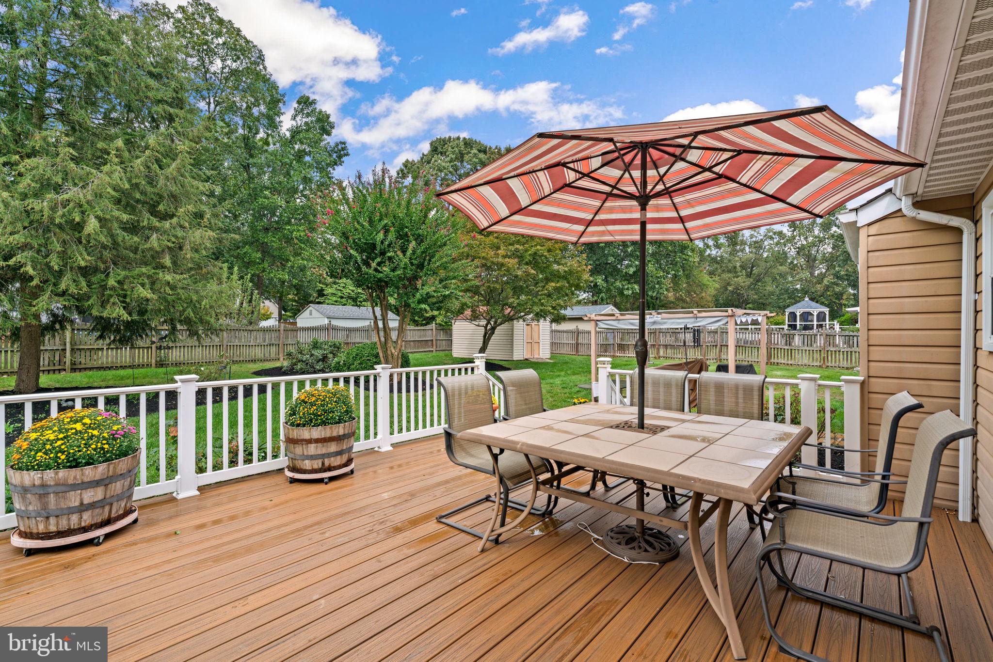 7884 Walnut Grove Road Severn, MD 21144 - Photo 39 of 42 a view of a patio with furniture and wooden floor