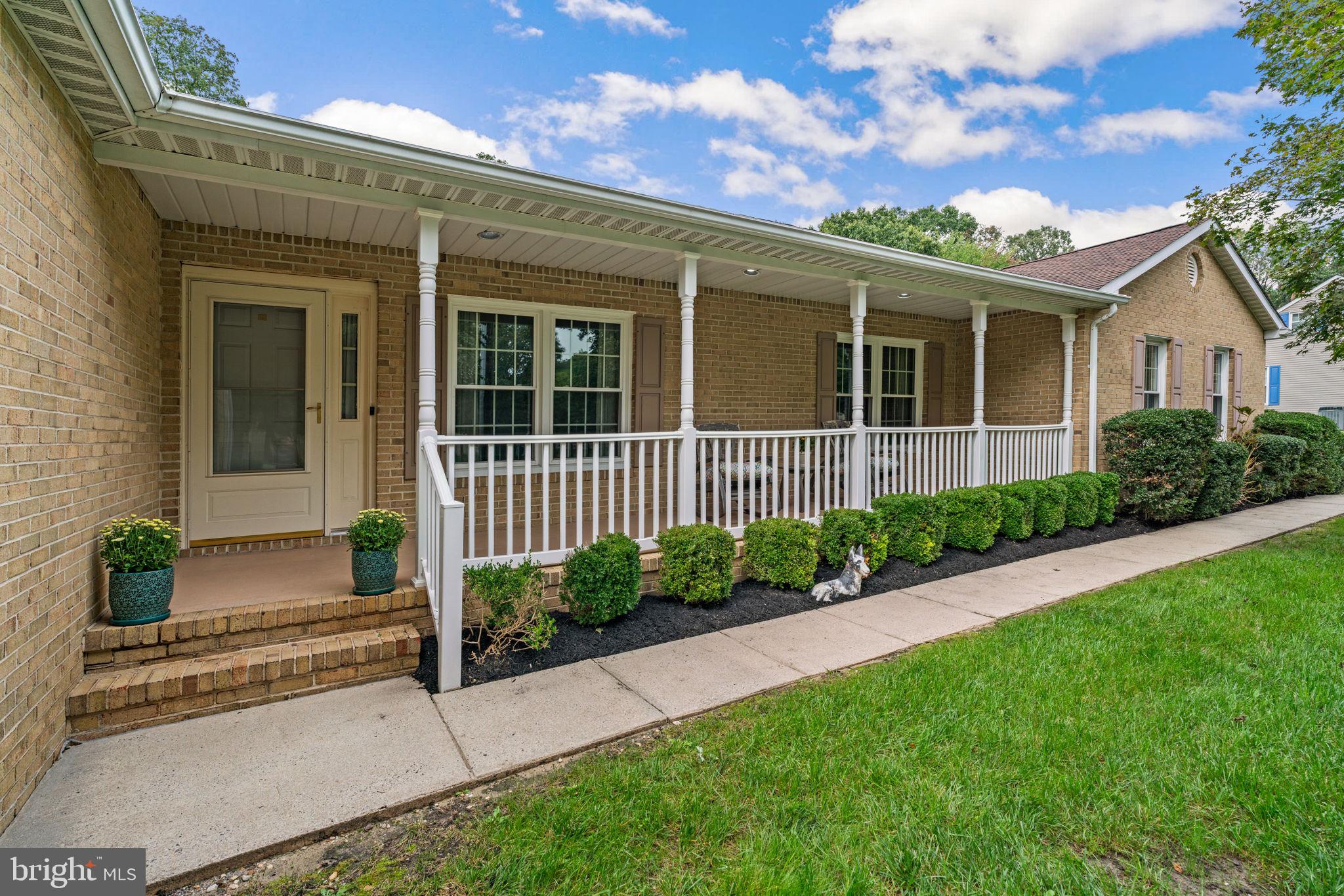 7884 Walnut Grove Road Severn, MD 21144 - Photo 4 of 42 front view of a house with a yard
