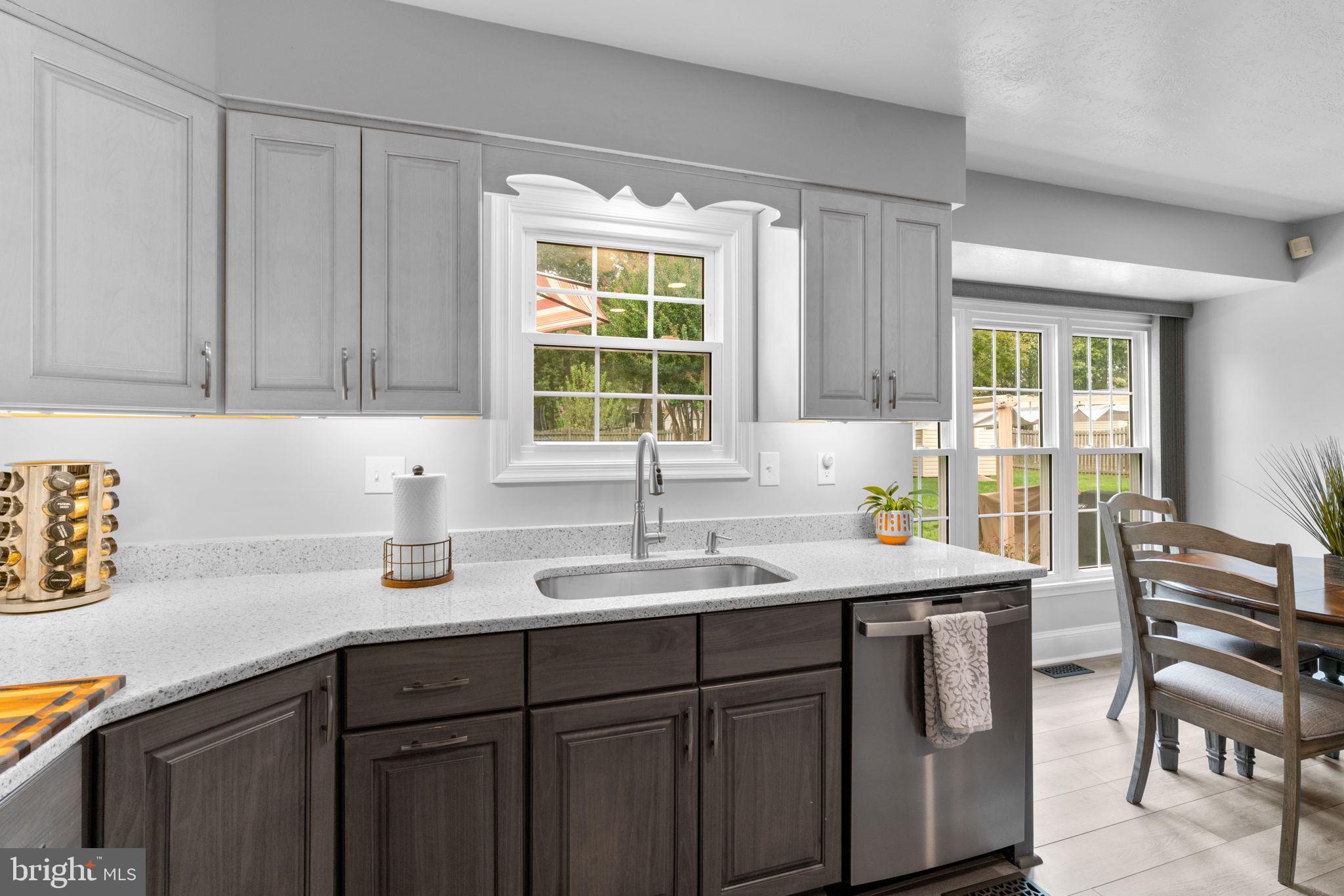 7884 Walnut Grove Road Severn, MD 21144 - Photo 9 of 42 a kitchen with a sink cabinets and window
