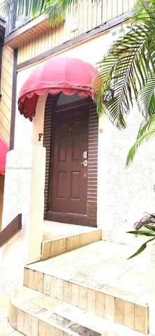 a view of a wooden door of the house