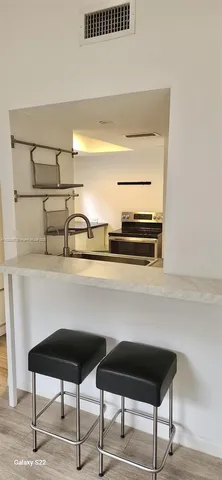 a room with a table and chairs