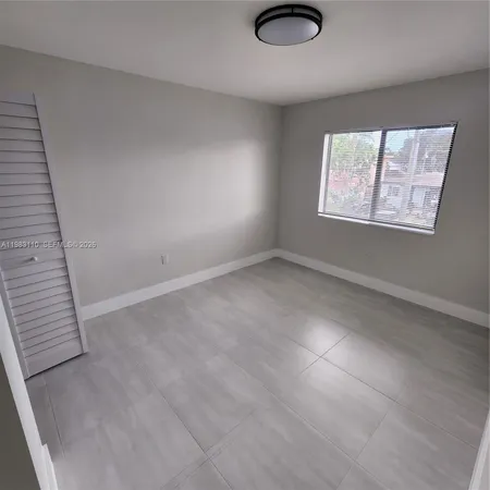 an empty room with a bathroom