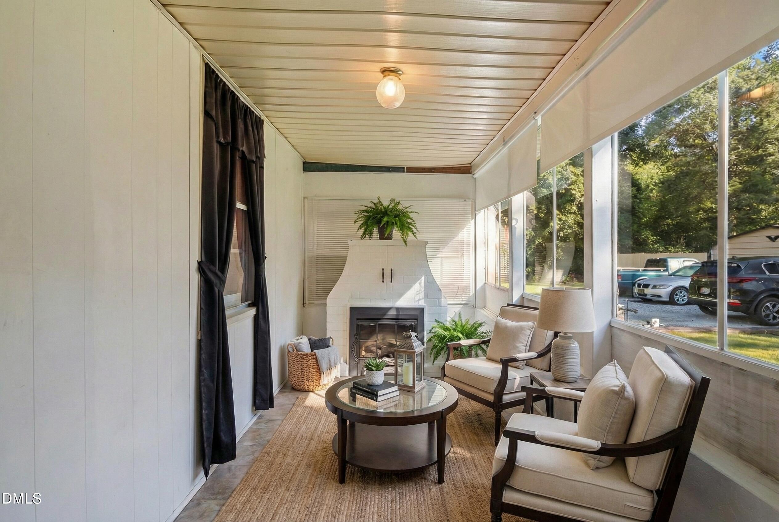 122 Old Surl Road Roxboro, NC 27574 - Photo 14 of 35 a living room with furniture and a fireplace
