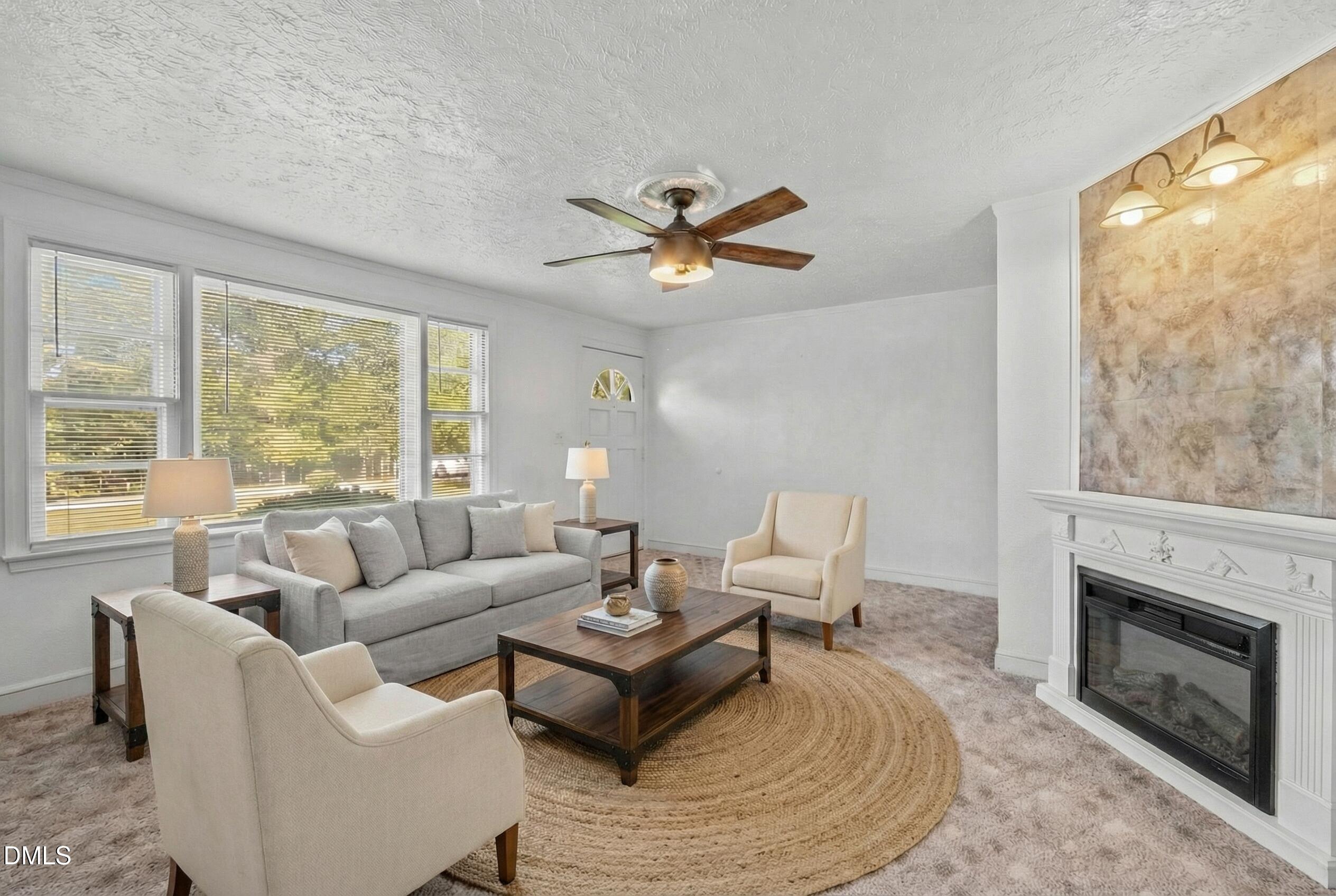 122 Old Surl Road Roxboro, NC 27574 - Photo 4 of 35 a living room with furniture a large window and a fireplace