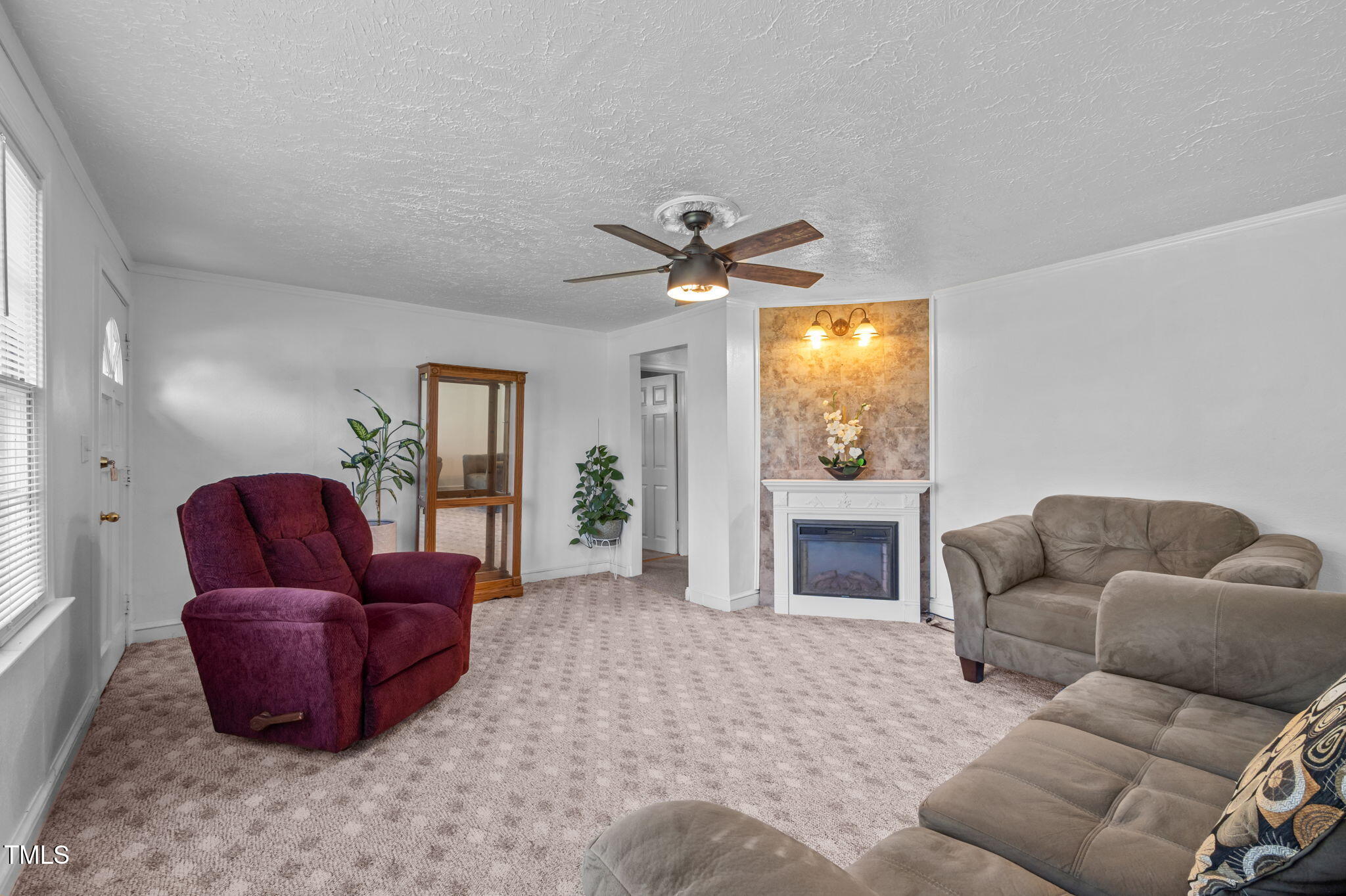 122 Old Surl Road Roxboro, NC 27574 - Photo 6 of 35 a living room with furniture a window and a fireplace