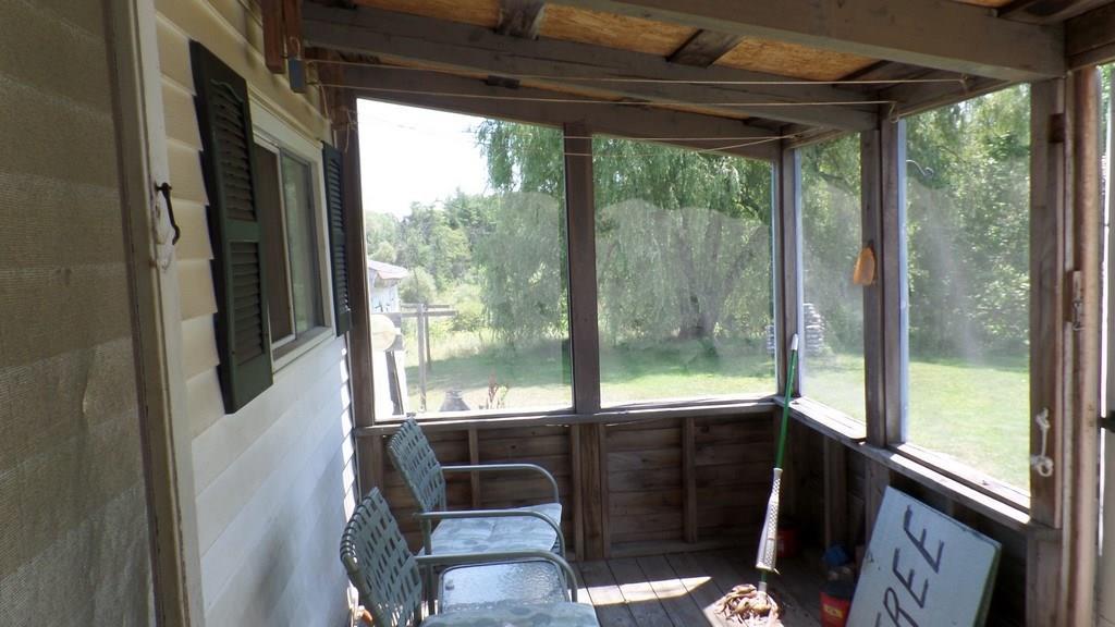 77 Eight Rod Road Augusta, ME 04330 - Photo 17 of 17 ENCLOSED BACK PORCH