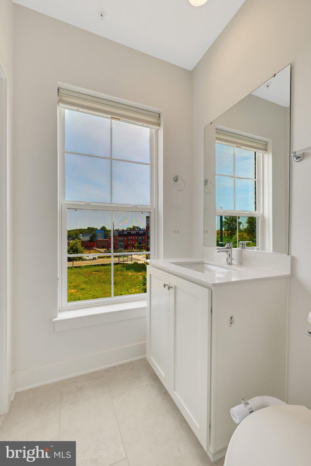 11247 Beaker Street Reston, VA 20190 - Photo 27 of 54 Bright and airy bathroom with a view.