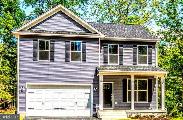 a front view of a house with glass windows