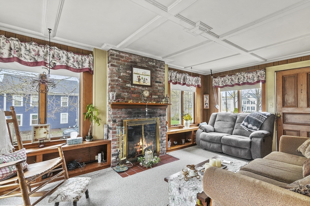 6 Prospect Street Merrimac, MA 01860 - Photo 11 of 40 a living room with furniture and a fireplace