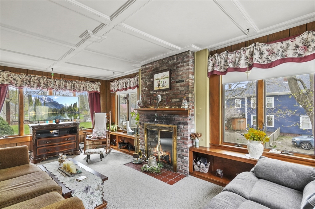 6 Prospect Street Merrimac, MA 01860 - Photo 12 of 40 a living room with furniture fireplace and flat screen tv