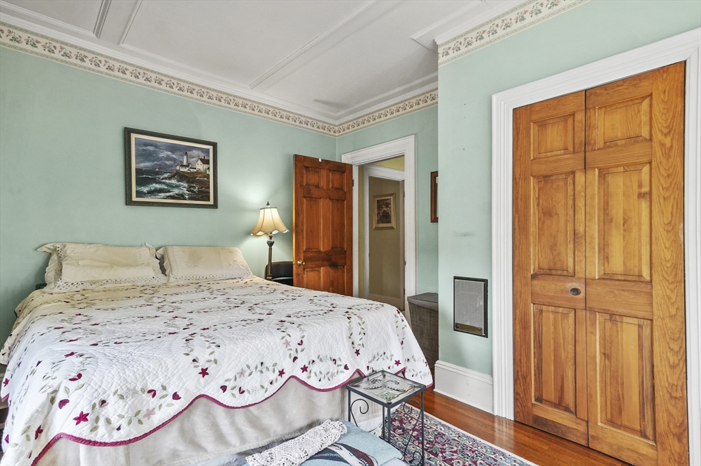 6 Prospect Street Merrimac, MA 01860 - Photo 15 of 40 a bed sitting in a bedroom next to a window