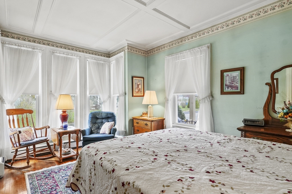 6 Prospect Street Merrimac, MA 01860 - Photo 16 of 40 a bedroom with a bed and large windows