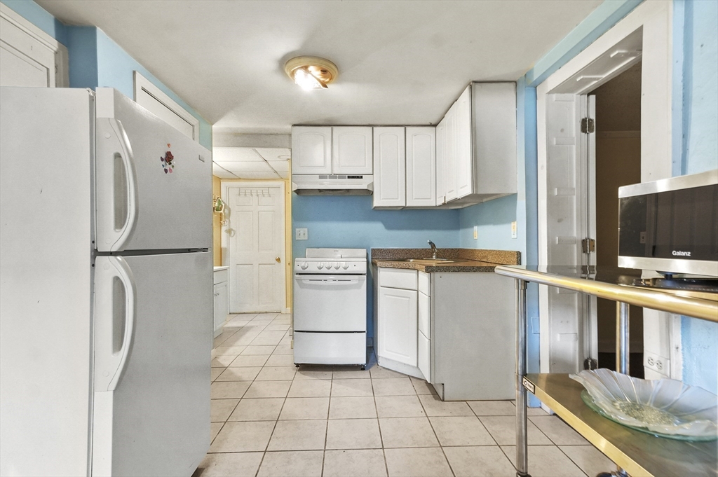 6 Prospect Street Merrimac, MA 01860 - Photo 18 of 40 a kitchen with a refrigerator sink and cabinets