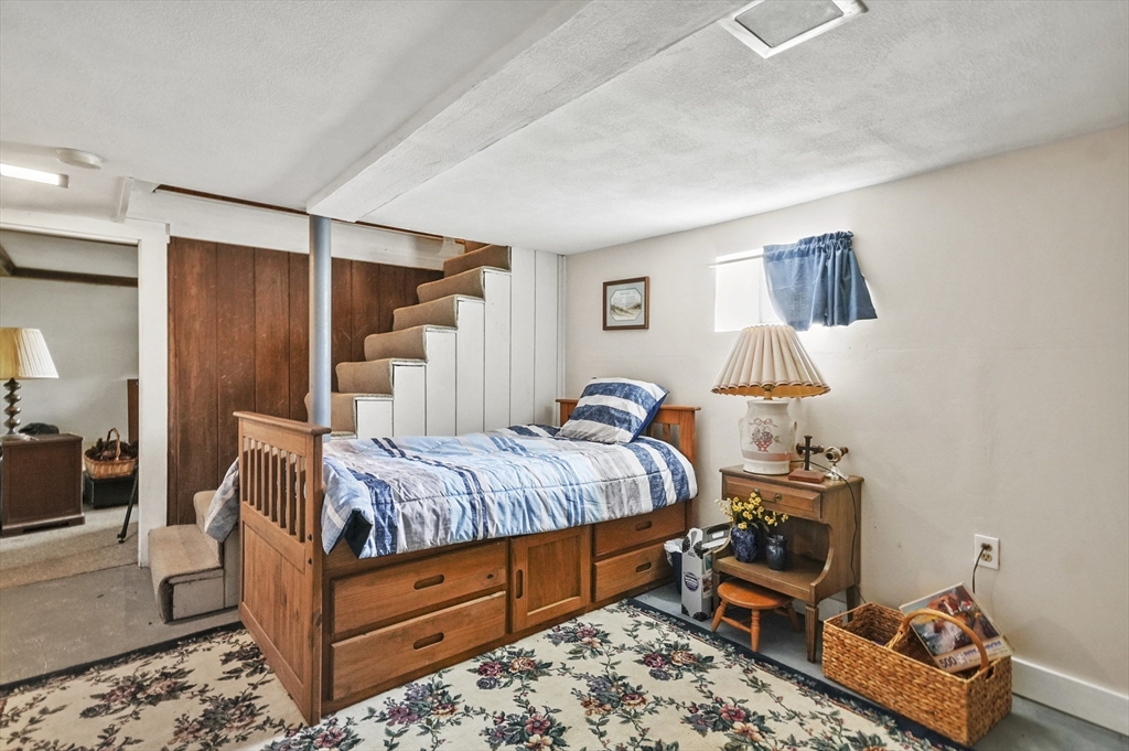 6 Prospect Street Merrimac, MA 01860 - Photo 19 of 40 a bedroom with bed and a couch