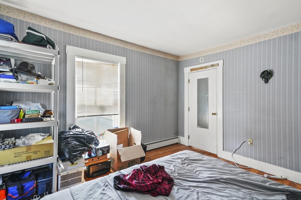 6 Prospect Street Merrimac, MA 01860 - Photo 21 of 40 a bedroom with bed and a closet