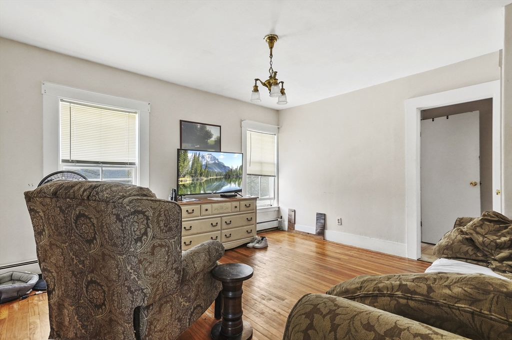 6 Prospect Street Merrimac, MA 01860 - Photo 22 of 40 a bedroom with a bed and a flat screen tv