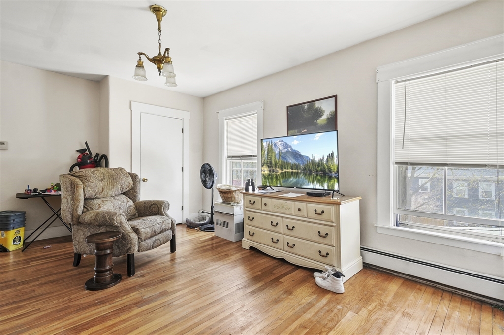 6 Prospect Street Merrimac, MA 01860 - Photo 23 of 40 a living room with furniture and a flat screen tv