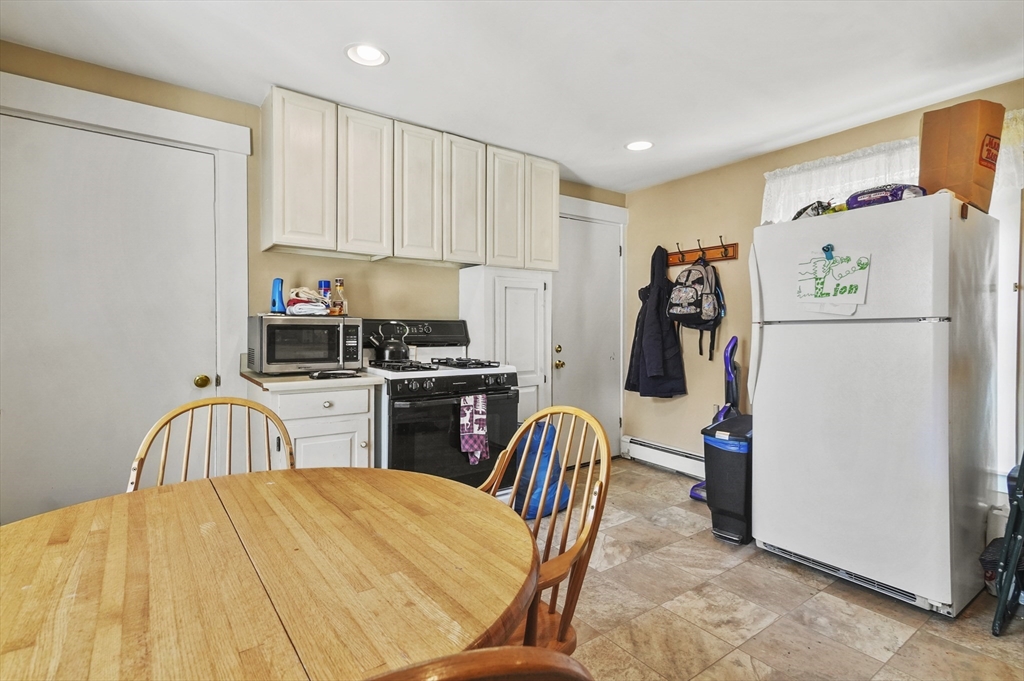 6 Prospect Street Merrimac, MA 01860 - Photo 24 of 40 a bedroom with a bed and a refrigerator