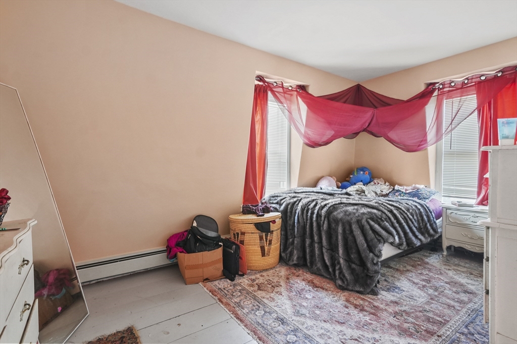 6 Prospect Street Merrimac, MA 01860 - Photo 27 of 40 a bedroom with a bed and a window