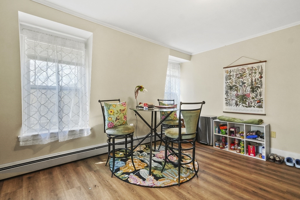 6 Prospect Street Merrimac, MA 01860 - Photo 28 of 40 a dining room with wooden floor and a table