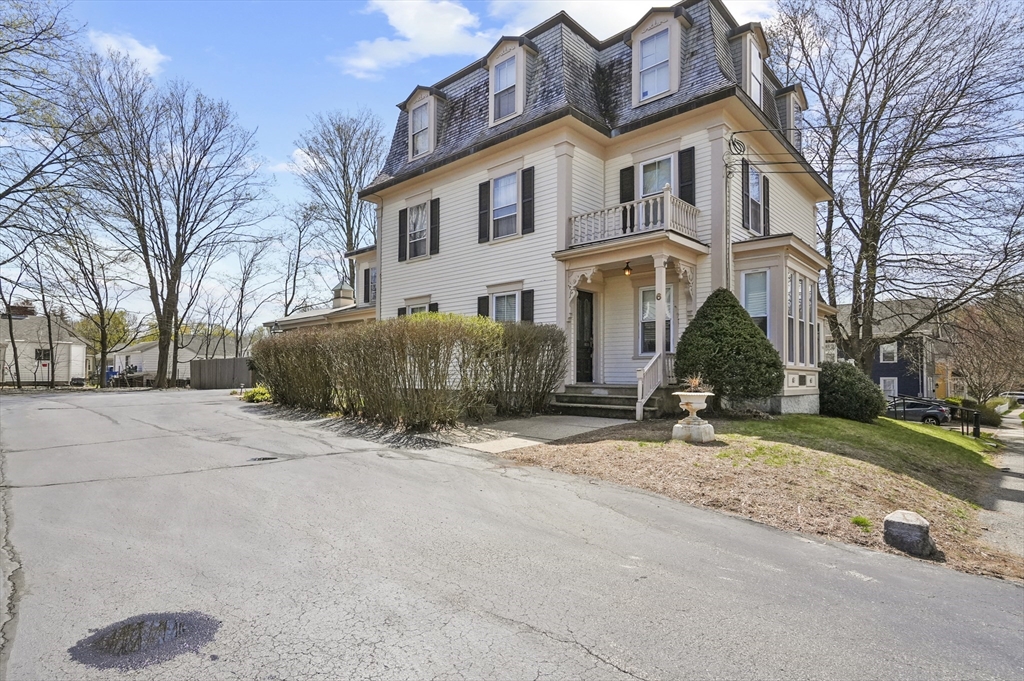 6 Prospect Street Merrimac, MA 01860 - Photo 33 of 40 a view of a white house with a large tree in front of it