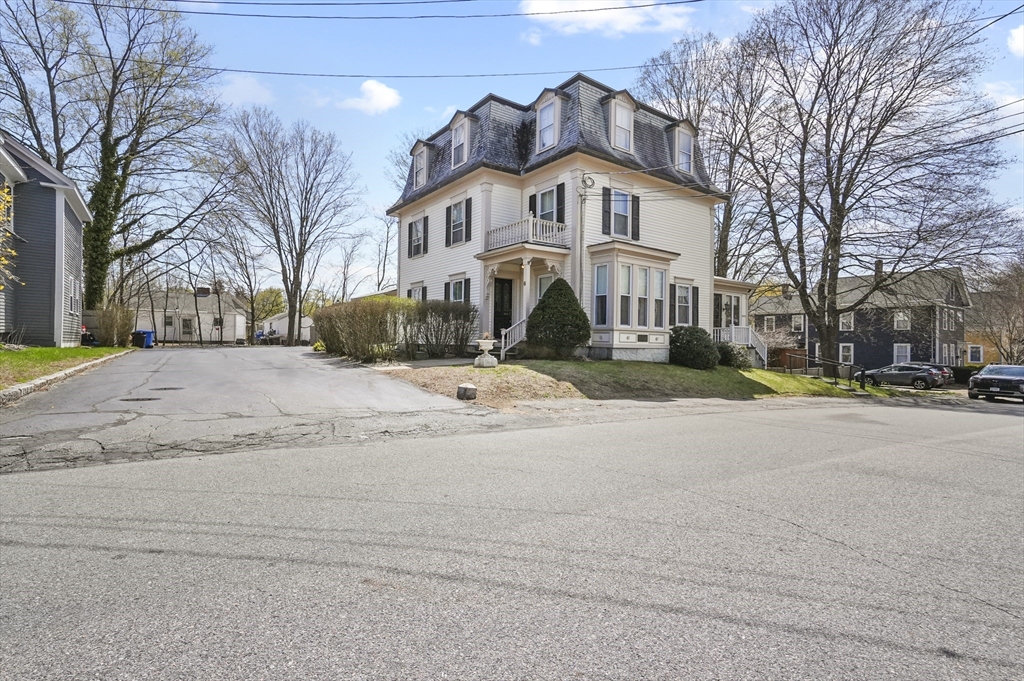 6 Prospect Street Merrimac, MA 01860 - Photo 34 of 40 a view of a white house with a yard