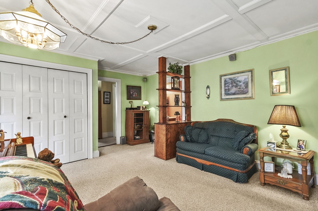 6 Prospect Street Merrimac, MA 01860 - Photo 7 of 40 a bedroom with a bed couch and window