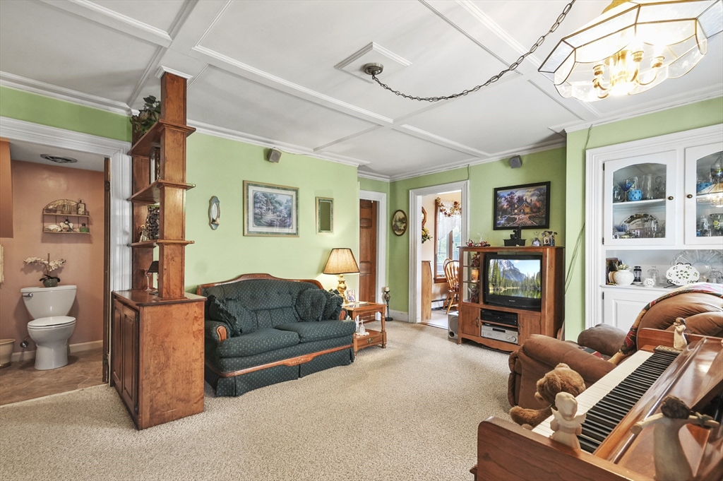 6 Prospect Street Merrimac, MA 01860 - Photo 8 of 40 a living room with furniture and a flat screen tv