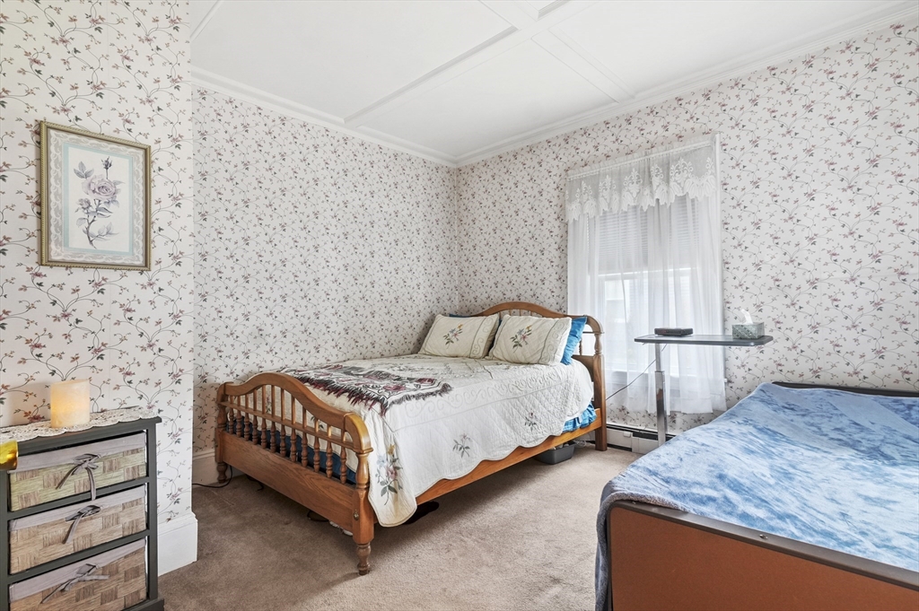 6 Prospect Street Merrimac, MA 01860 - Photo 10 of 40 a bedroom with bed and cabinets