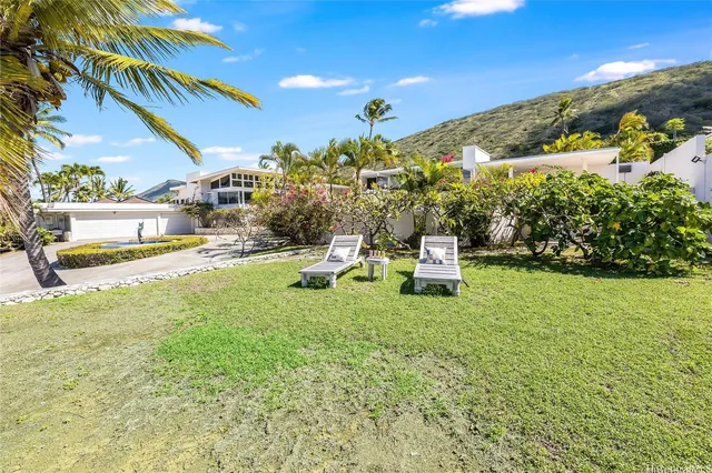 a view of a large yard with an ocean view