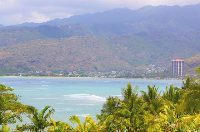 a view of a balcony with floor to ceiling windows