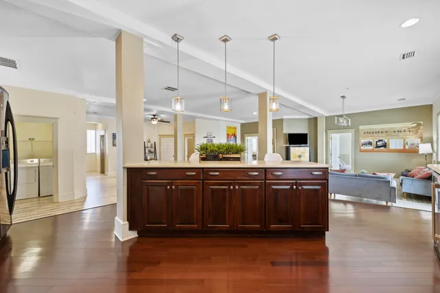 a bathroom with a granite countertop sink a toilet and bathtub