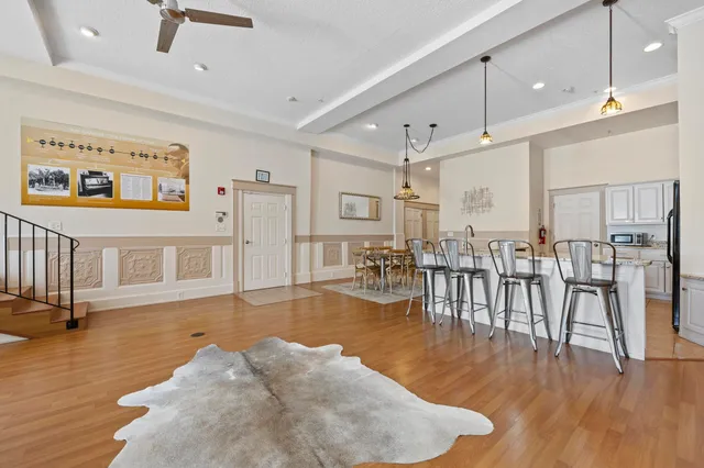 a kitchen with stainless steel appliances granite countertop a sink counter space cabinets and a stove