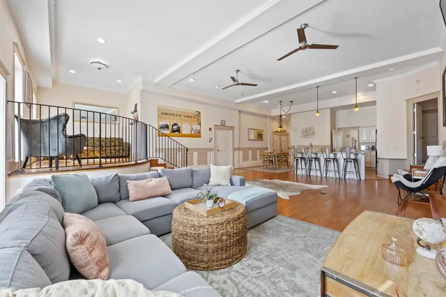 a bedroom with a bed a table and chair