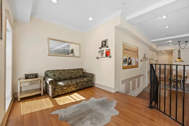 a bathroom with a granite countertop toilet sink and mirror