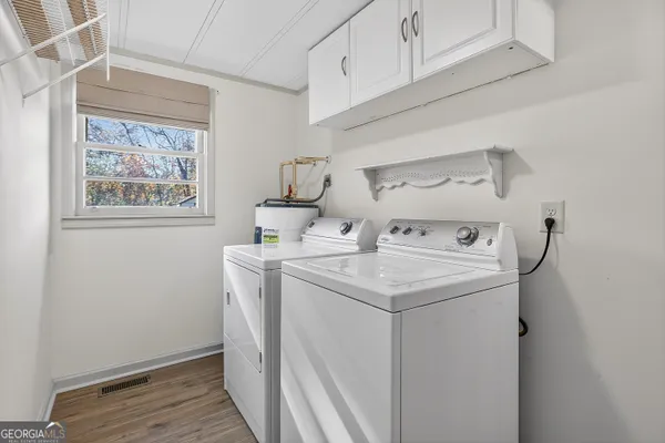 a utility room with dryer and washer