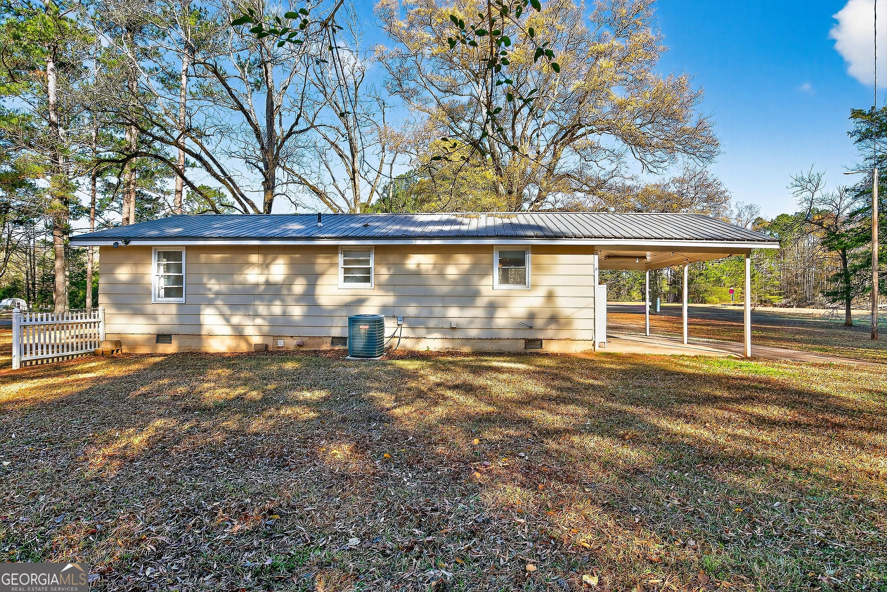 1470 Melville Brown Road Williamson, GA 30292 - Photo 19 of 36 a view of a house with a yard and garage